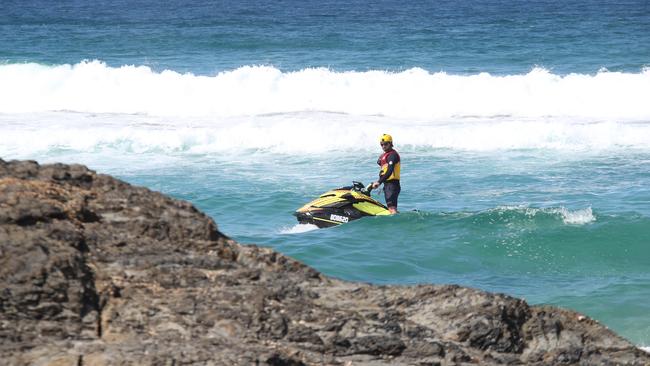 Lifesavers and police continue their search around Elephant Rock at Currumbin where it is feared a woman was swept off the rocks more than 35 hours ago. Picture Glenn Hampson