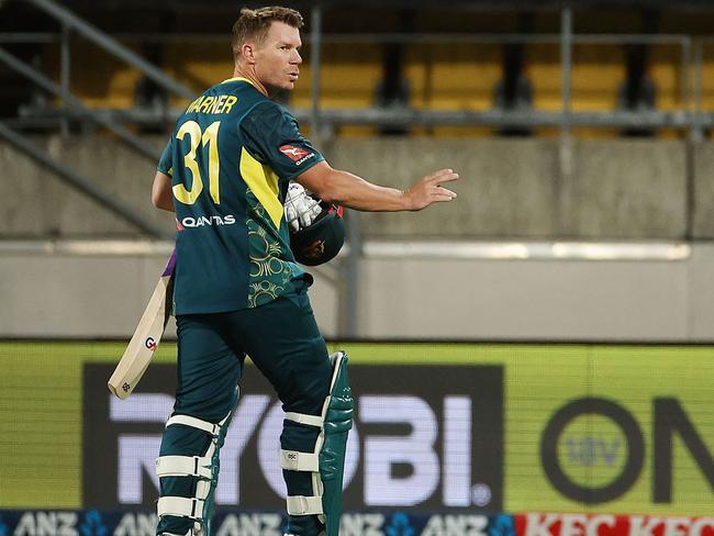 Australia's David Warner walks from the field after being caught during the first Twenty20 international cricket match between New Zealand and Australia at Sky Stadium in Wellington on February 21, 2024. (Photo by Marty MELVILLE / AFP)