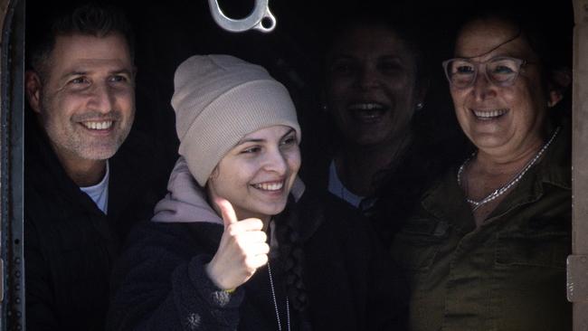 Daniella Gilboa gives thumbs up to the waiting crowd from the door of the helicopter after arriving at Belinson-Schneider Hospital. Picture: Getty Images