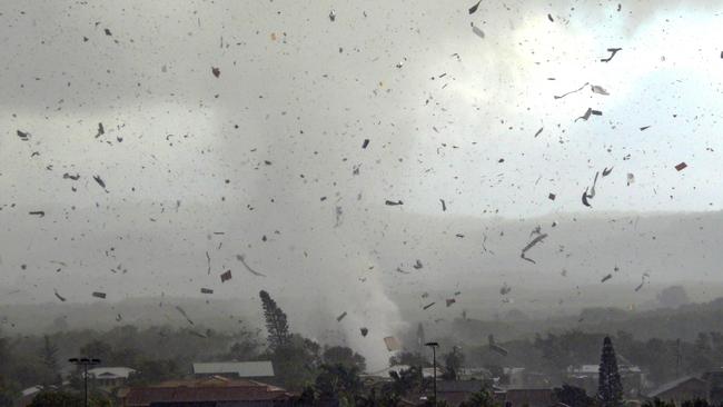 Debris flying through the air as the tornado tore through the coastal town