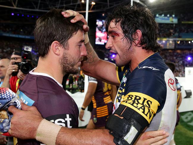 Ben Hunt and Johnathan Thurston after the 2015 NRL Grand Final. Pics Adam Head