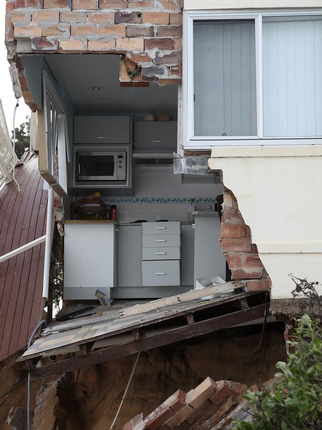 The huge swells ripped open the wall to the kitchen of this house. Picture: David Swift