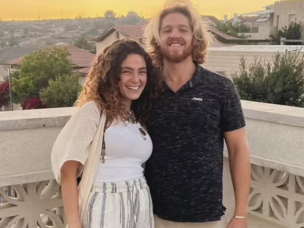 A 27-year-old Israeli model who survived the Hamas festival massacre has recounted how she was forced to hide under her boyfriend‘s dead body