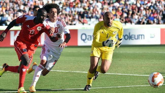 UAE’s Omar Abdulrahman chases the ball in the middle of the Bahrain defence.