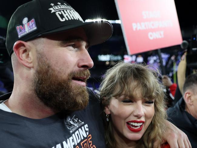 Travis Kelce of the Kansas City Chiefs celebrates with Taylor Swift. (Photo by Patrick Smith/Getty Images)