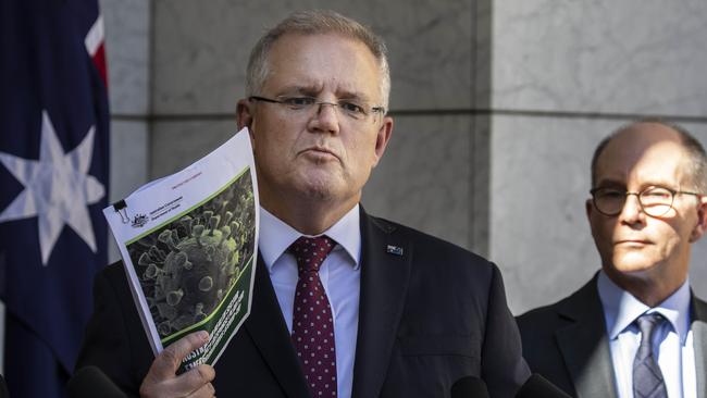 Prime Minister Scott Morrison with deputy Chief Medical Officer Paul Kelly announcing Australia has launched its global pandemic emergency response plan. Picture: Gary Ramage