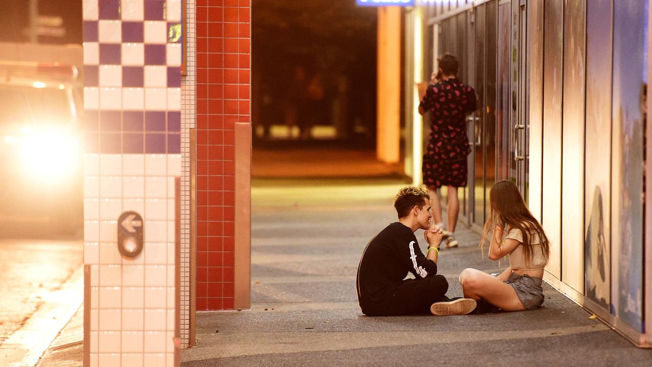 New Year's Eve revellers found plenty of places to take a breather in the CBD - including outside the police station - following a big night of New Year's Eve celebrating