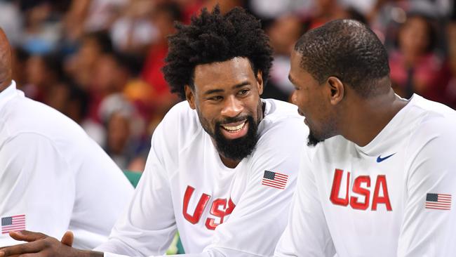 DeAndre Jordan (L) talks with Kevin Durant during Team USA’s game against Venezuela.