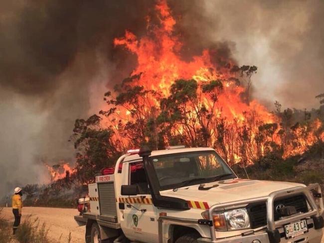 Firefighters face a wall of fire at Miena. Picture: ALEX ELDRIGE