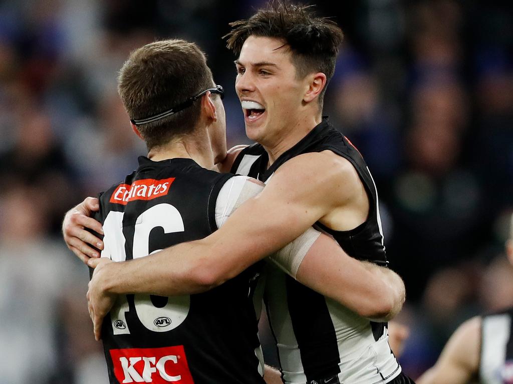 Mason Cox and Ollie Henry celebrate for the Pies. Picture: AFL Photos/Getty Images