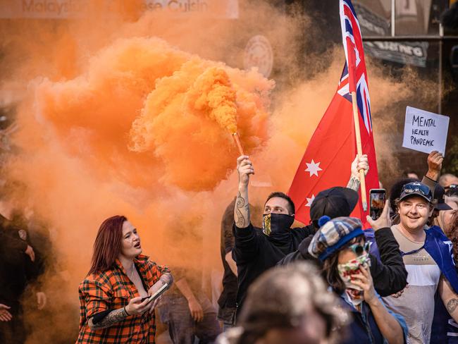 Flares were lit at the protests in Melbourne. Picture: Jason Edwards