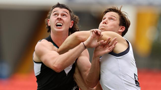 Port Adelaide’s Darcy Byrne-Jones and GWS milestone man Toby Greene fight for position. Picture: Michael Klein