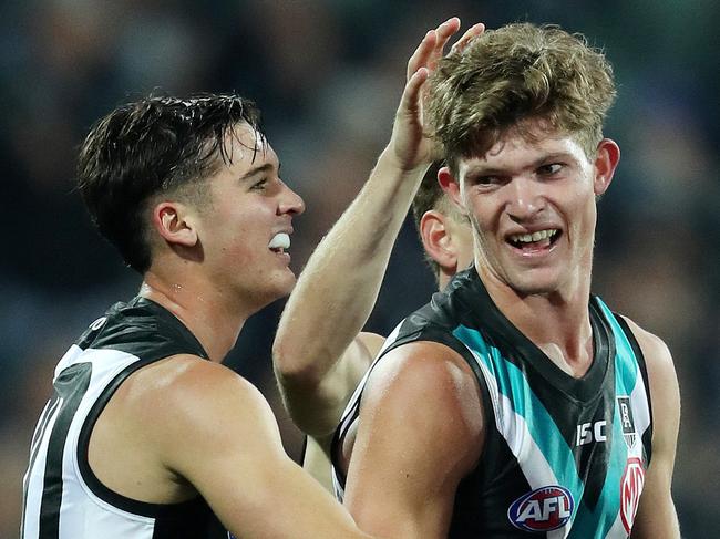 AFL - Saturday, 25th July, 2020 - Port Adelaide v St Kilda at Adelaide Oval. Port Adelaide's Mitch Georgiades celebrate his goal with Connor Rozee and Zak Butters Picture: Sarah Reed