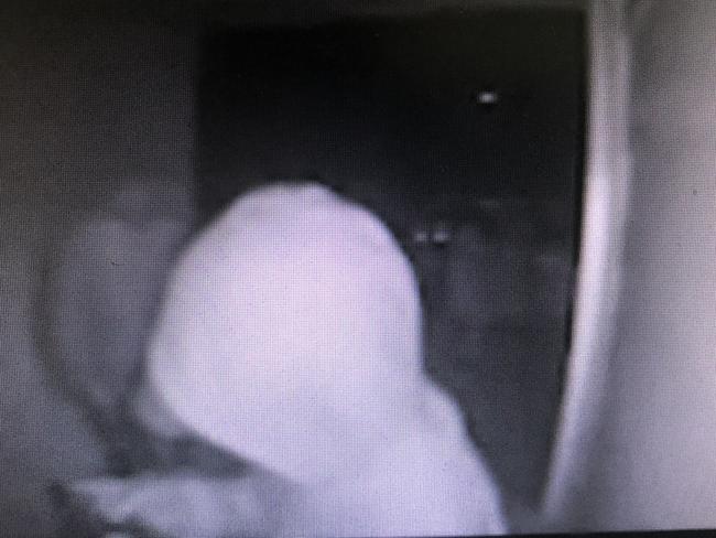 A still  from CCTV security video captured at a home on the northern beaches showing a group of males trying to break into the front door of a private home. Picture: Supplied