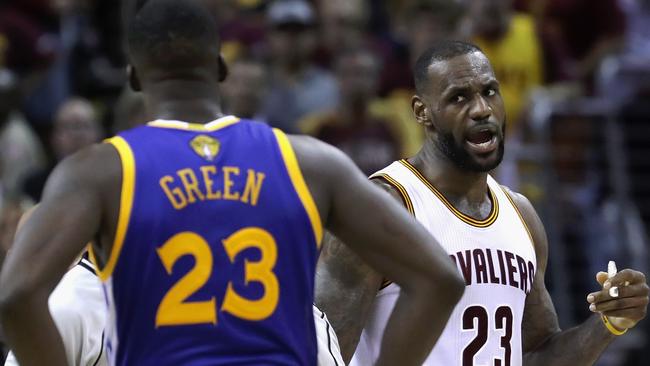 LeBron James of the Cleveland Cavaliers and Draymond Green of the Golden State Warriors exchange words.