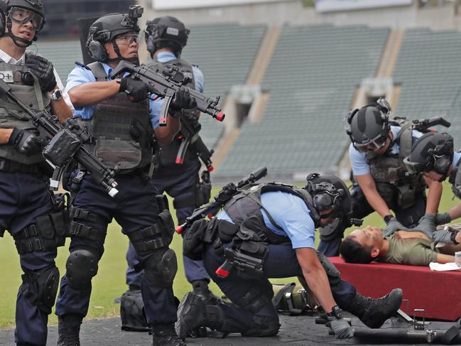 Police units take part in an anti-terror drill in Hong Kong, Friday, Aug. 25, 2017. Officers, some of them posing as assailants, held a simulated a terror attack at a concert as part of preparations for a performance in the Hong Kong on Sep. 21 by singer Ariana Grande. (AP Photo/Vincent Yu)