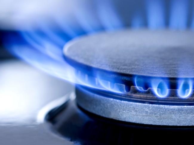 Blue flames from gas stove burner. Closeup shot of blue flames from a kitchen gas range.