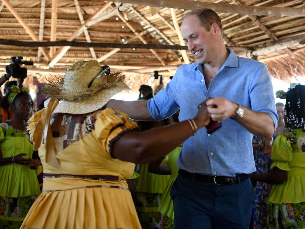 Prince William dances with a Garifuna women in Belize, 2022. Picture: Johan Ordonez / AFP