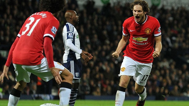 Manchester United's Dutch midfielder Daley Blind (R) celebrates scoring their second goal during the English Premier League football match between West Bromwich Albion and Manchester United at The Hawthorns in West Bromwich, central England on October 20, 2014. AFP PHOTO / PAUL ELLIS RESTRICTED TO EDITORIAL USE. No use with unauthorized audio, video, data, fixture lists, club/league logos or “live” services. Online in-match use limited to 45 images, no video emulation. No use in betting, games or single club/league/player publications.