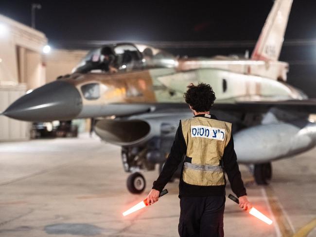 This handout picture released by the Israeli army on October 26, 2024, shows an Israeli fighter jet departing a hangar at an undisclosed location in Israel. The Israeli military said on October 26, it had completed its air attack on Iran, saying it hit the Islamic republic's missile manufacturing facilities, surface-to-air missile arrays and other aerial capabilities across several areas of the country. (Photo by AFP) / === RESTRICTED TO EDITORIAL USE - MANDATORY CREDIT "AFP PHOTO / Handout / Israeli Army' - NO MARKETING NO ADVERTISING CAMPAIGNS - DISTRIBUTED AS A SERVICE TO CLIENTS ==