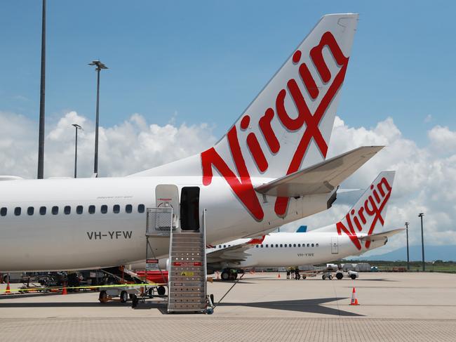 A Virgin Australia Boeing 737 passenger jet aircraft on the tarmac apron at Cairns Airport. Picture: Brendan Radke