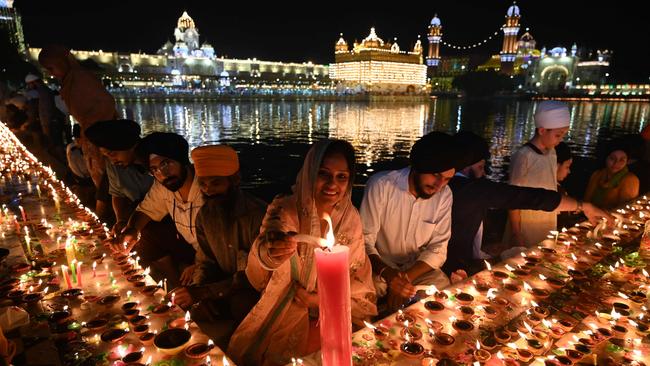 The ascent of Rishi Sunak coincided with Diwali. Here devotees light candles in Amritsar on Thursday. Picture: AFP