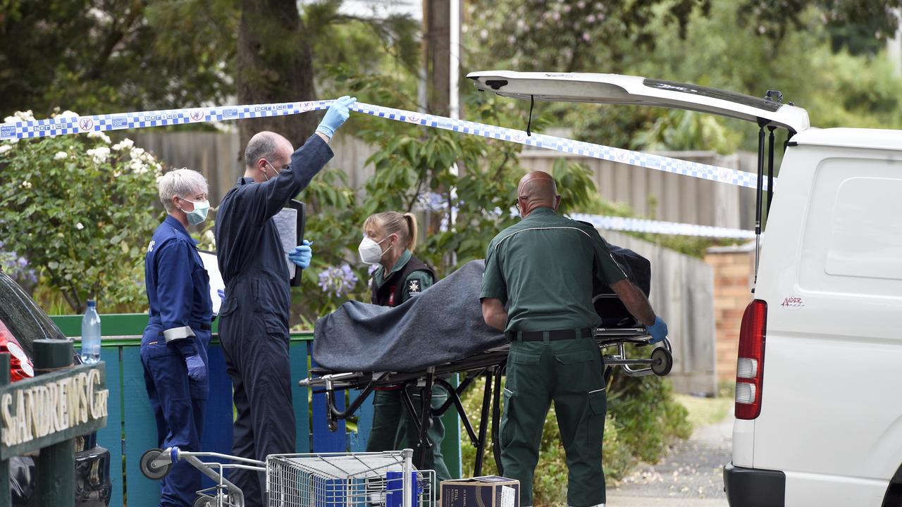 One of the victims of a double murder is removed from a property at McDonald Street Mordialloc. Picture: Andrew Henshaw