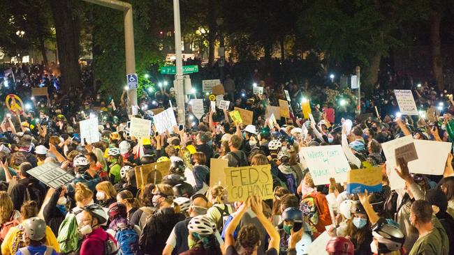 Protesters wave placards and shout slogans as they take part in a rally against police brutality in Portland. Picture: AFP