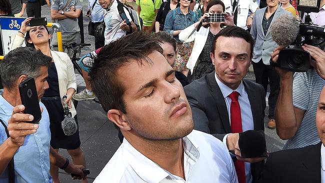 Gable Tostee reacts as he leaves the Supreme Court in Brisbane. (AAP Image/Dave Hunt)