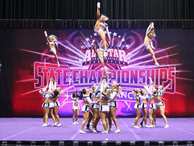 Members of the Queensland Cheer Elite squad perform at the All Star State Cheerleading Championships.