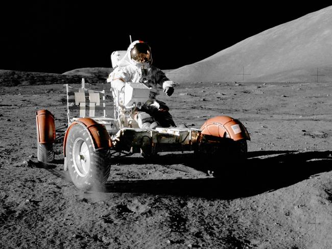 Gene Cernan test drives the Apollo 17 lunar rover.