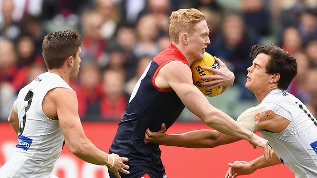 Clayton Oliver tries to break a Jack Silvagni tackle. Picture: Getty Images