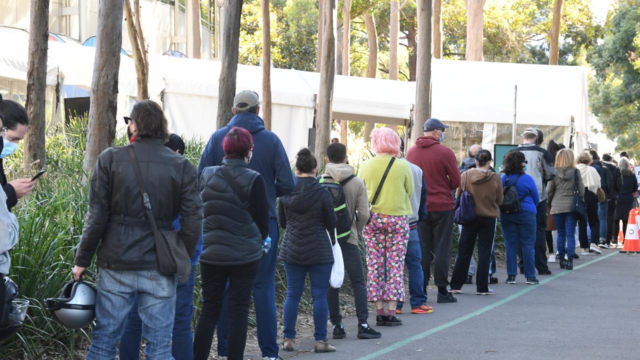 People queue to receive the Covid vaccine at the New South Health Vaccination Centre at Sydney Olympic Park last week. Picture: James D. Morgan/Getty Images.