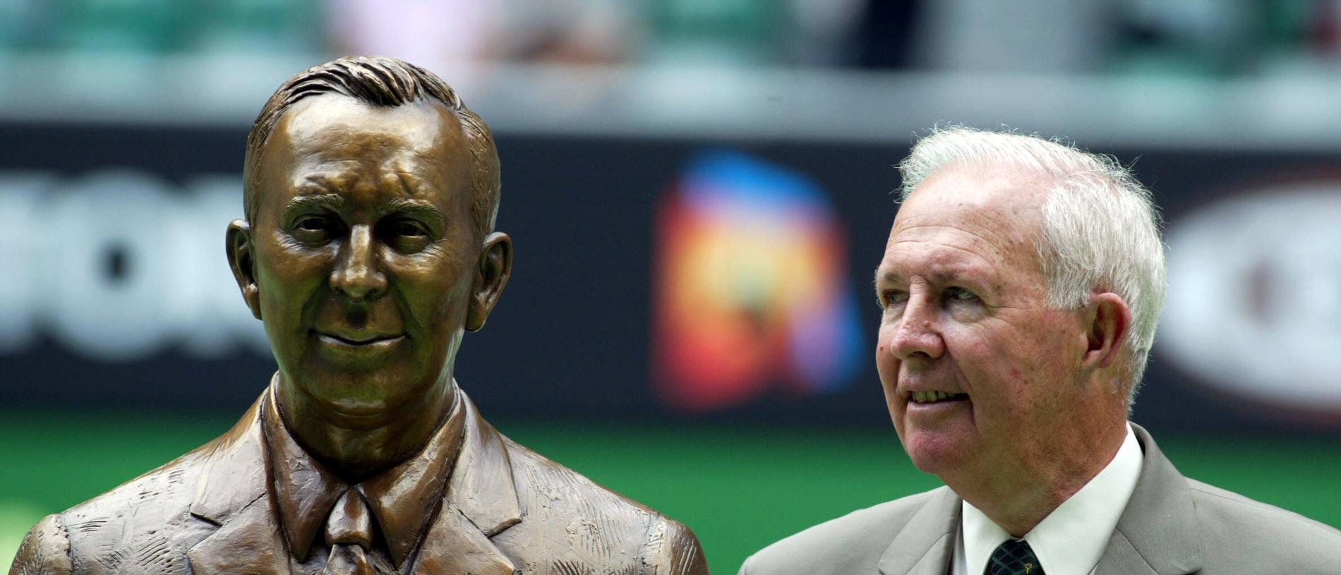 Brian Tobin stands beside his bust after being inducted into the Tennis Hall of Fame. Australian Open.  Tennis Day 8.