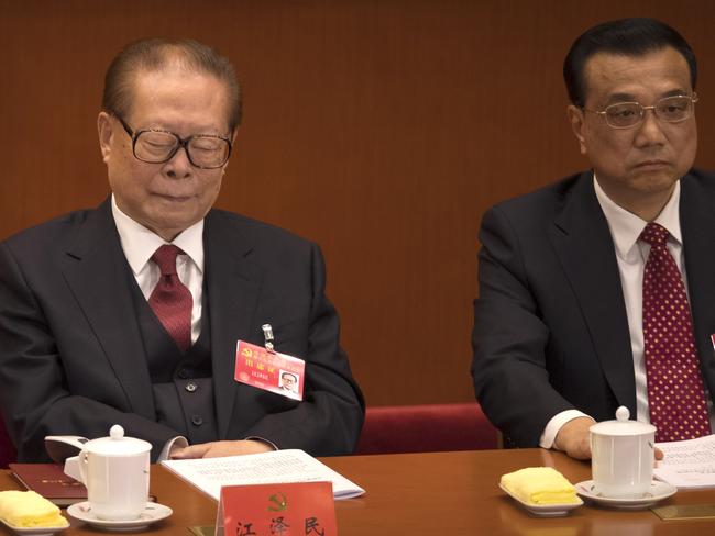 Former Chinese President Jiang Zemin closes his eyes during the President’s long speech. Picture: Mark Schiefelbein/AP