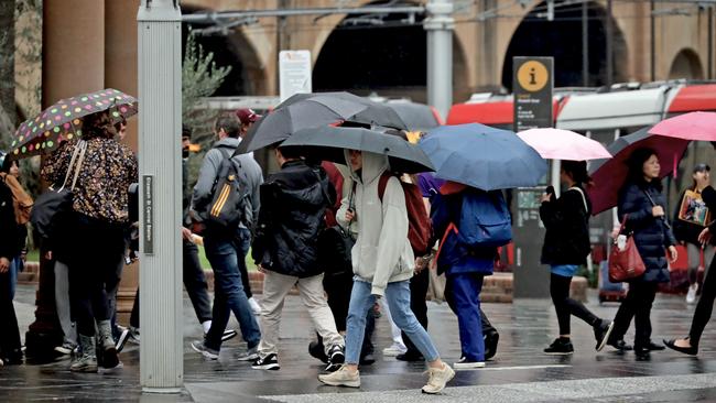 The record hot weather was unlikely to be felt by Australians shivering through winter, including a wet day in Sydney on Tuesday. Picture: NCA NewsWire / Nicholas Eagar