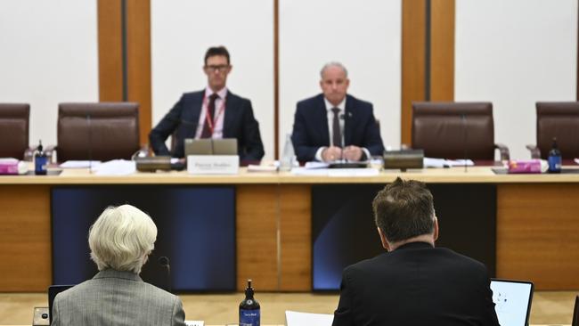 Kevin Burrowes beside chief risk and ethics leader Jan McCahey at the Senate committee hearing. Picture: Martin Ollman