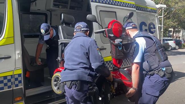 Police retreive the stolen scooter in Ultimo. Picture: Mitchell Van Homrigh