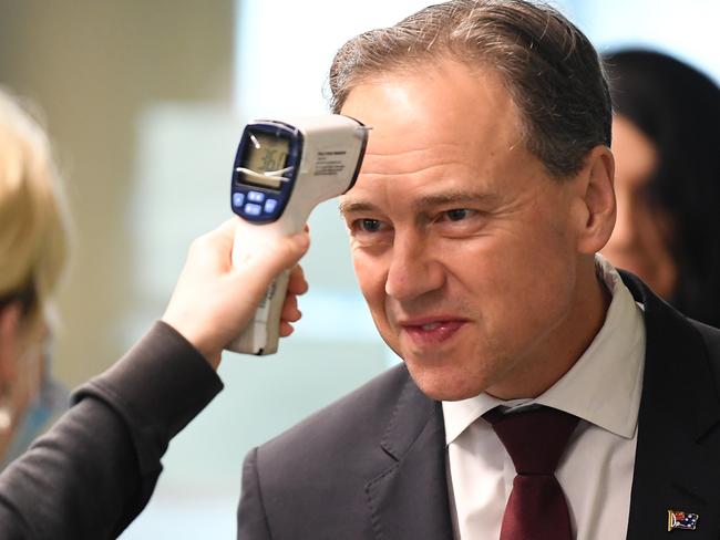 Federal Health Minister Greg Hunt having his temperature checked. Picture: AAP