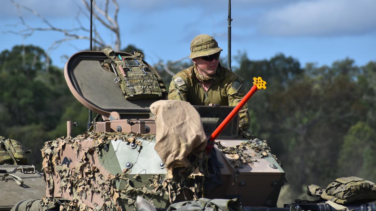 A soldier in an armoured personnel carrier at the Shoalwater Bay Training Area for Exercise Diamond Walk 2021.