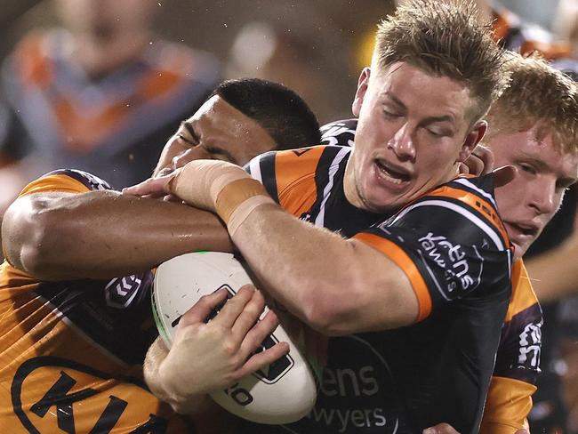 SYDNEY, AUSTRALIA - JULY 17: Harry Grant of the Wests Tigers is tackled during the round 10 NRL match between the Wests Tigers and the Brisbane Broncos at Leichhardt Oval on July 17, 2020 in Sydney, Australia. (Photo by Cameron Spencer/Getty Images)