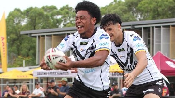 Tomo Cook playing for Souths Logan last season is about to score.