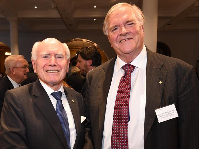 Former Prime Minister John Howard (L) shakes Kim Beazley's hand at the launch of the Ramsay Centre for Western Civilisation in Sydney, Monday, November 20, 2017 (AAP Image/Peter Rae) NO ARCHIVING