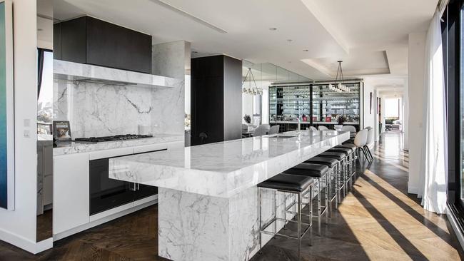 The South Melbourne penthouse’s marble-drenched kitchen.