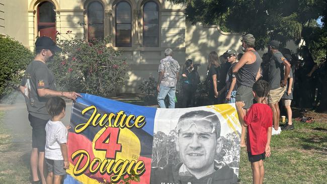 A tribute sign of Dougie held at the smoking ceremony on Monday morning before court. Picture: Tijana Birdjan