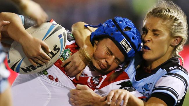 Erin Blackwell taken down by Alana Ferguson in the first women’s NRL nines match between the Cronulla Sharks and St George Dragons.