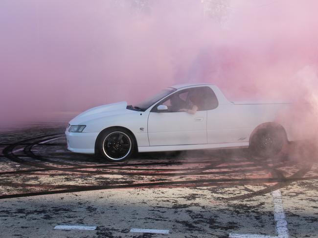 Regular burnout competition entrant Jai Goward, of Gladstone, performs a burnout in his Holden Commodore SS ute under controlled conditions. Mr Goward said he doesn't condone anyone doing burnouts on public roads. Picture: Rodney Stevens