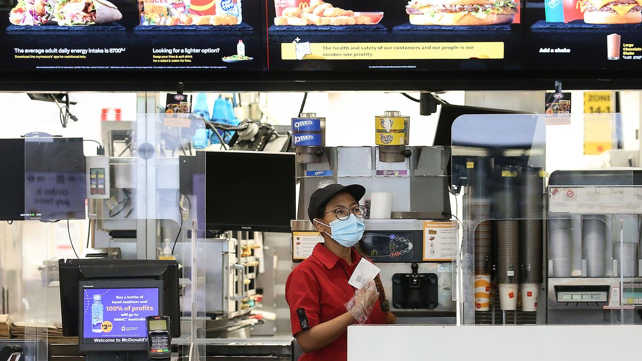 Staff at McDonald’s stores across New South Wales must now wear a face mask during their shifts, amid growing calls to make masks mandatory. Picture: NCA NewsWire / Ian Currie