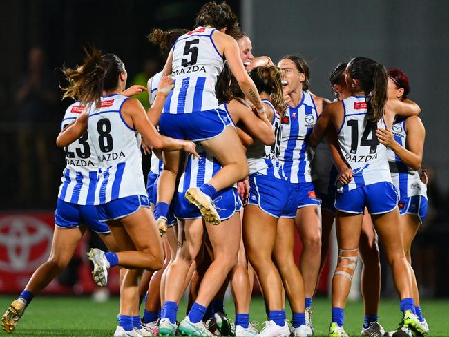 North Melbourne’s celebrations start on the final siren.