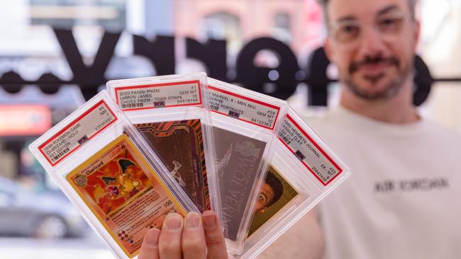 Tasmanian trading card collector, Grayson White with a selection of rare trading cards. Picture: Linda Higginson